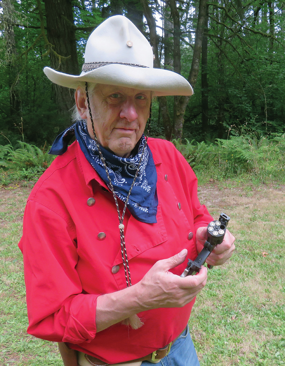 Loading the top-break revolver with five rounds.